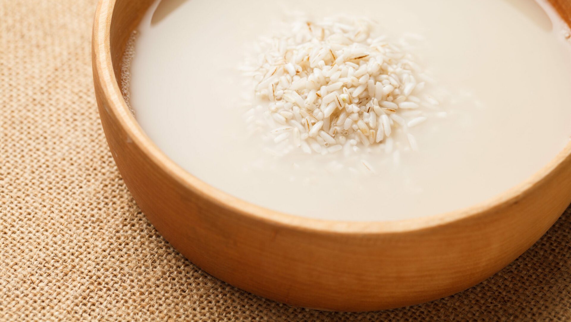 Wash,Rice,In,Wooden,Bowl